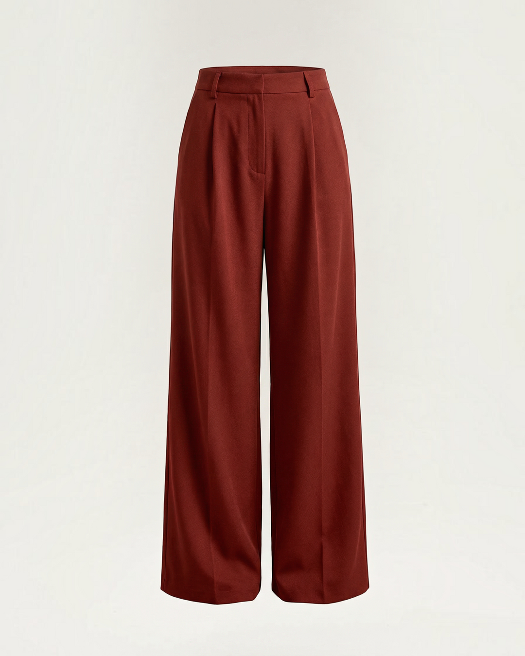 Luna Moda Stefania high-waisted wide-leg trousers in deep rust red with front pleats and architectural tailoring.