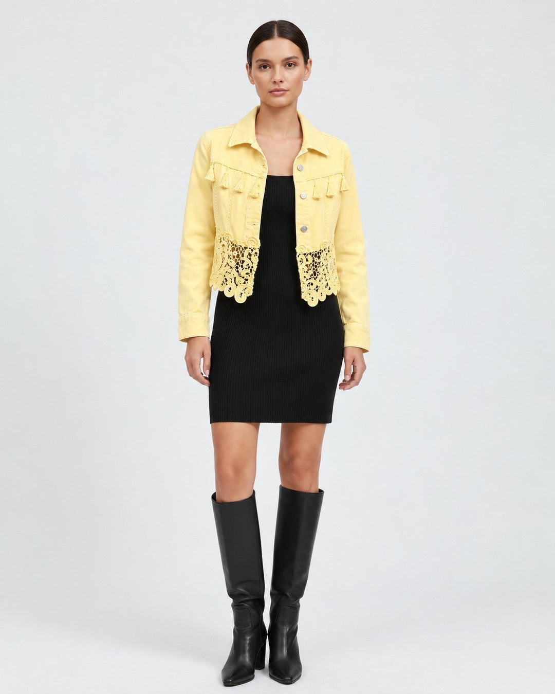 Luna Moda yellow denim-style jacket with chest fringe and lace hem worn by a model over a black dress