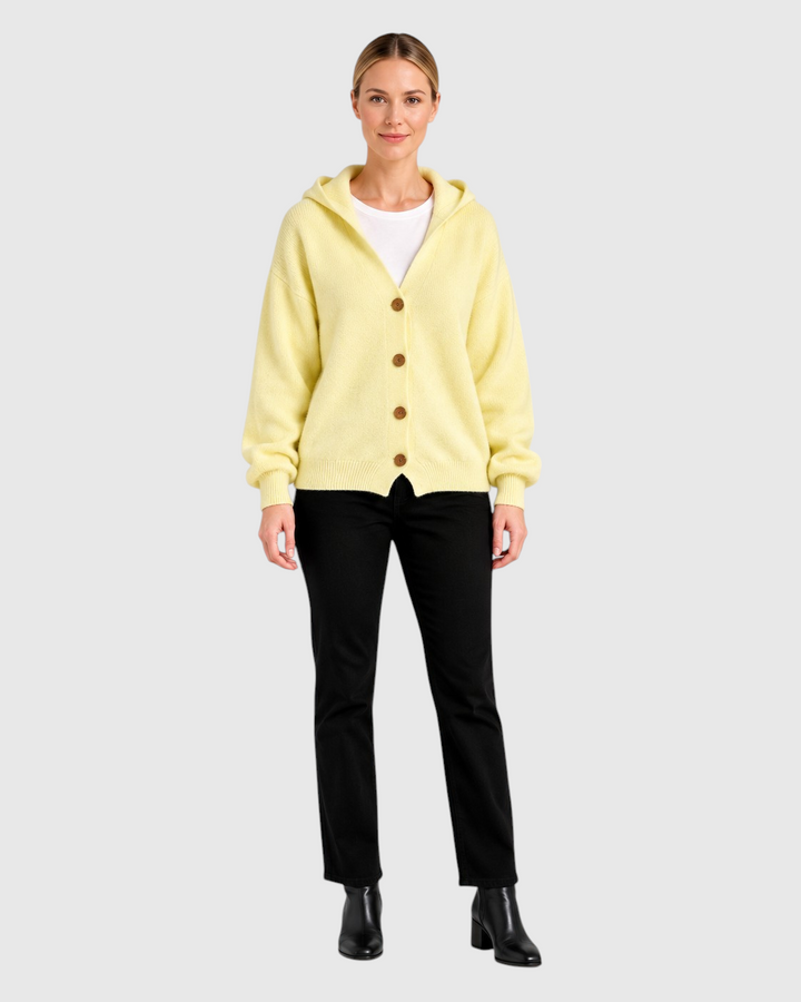 Luna Moda Diana light yellow cotton hooded cardigan with front buttons worn by a model with black trousers