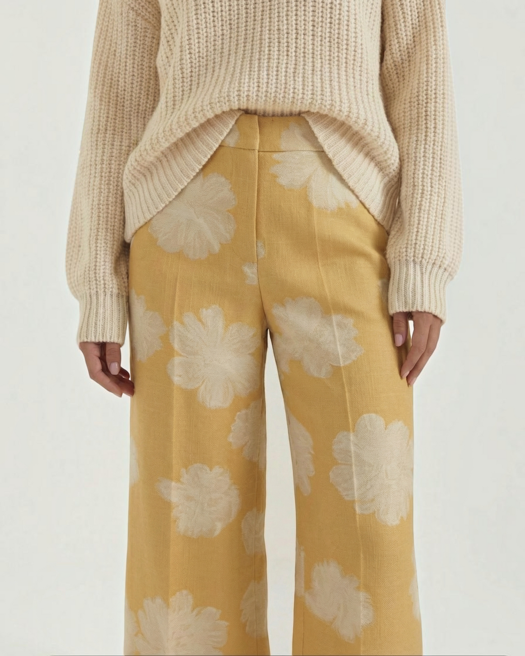 Luna Moda Ariella wide-leg lounge pants in yellow with a white floral print, paired with a cream knit sweater.