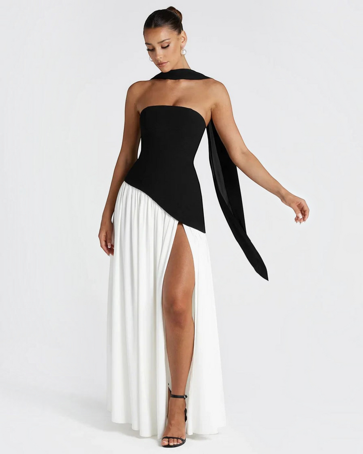Luna Moda Zadie maxi dress featuring a black strapless bodice with a scarf detail and a white skirt with a high slit.