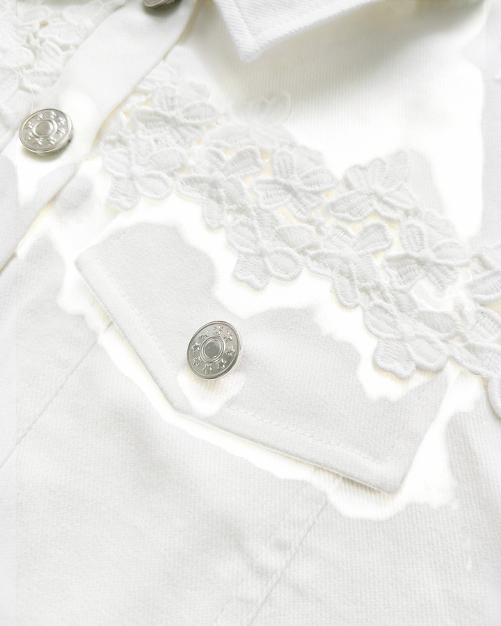 Luna Moda Elisabetta white jacket featuring delicate floral lace shoulder panels and silver-toned chest buttons.