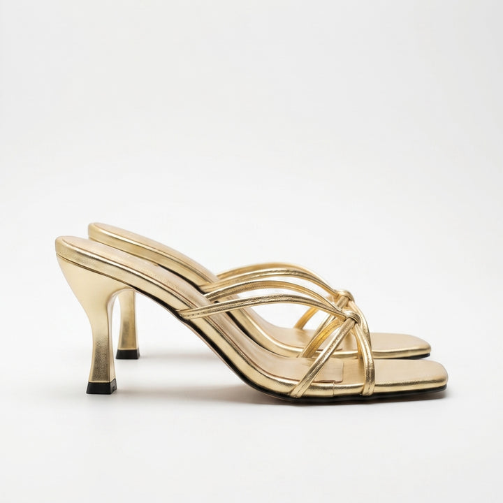 Luna Moda Christina gold metallic mule sandals with knotted straps and a 5 cm heel, featuring a square toe design.