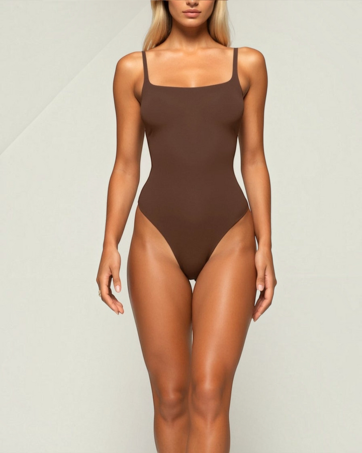Luna Moda chocolate brown sculpting thong bodysuit with a square neckline and high-cut leg on a blonde model.
