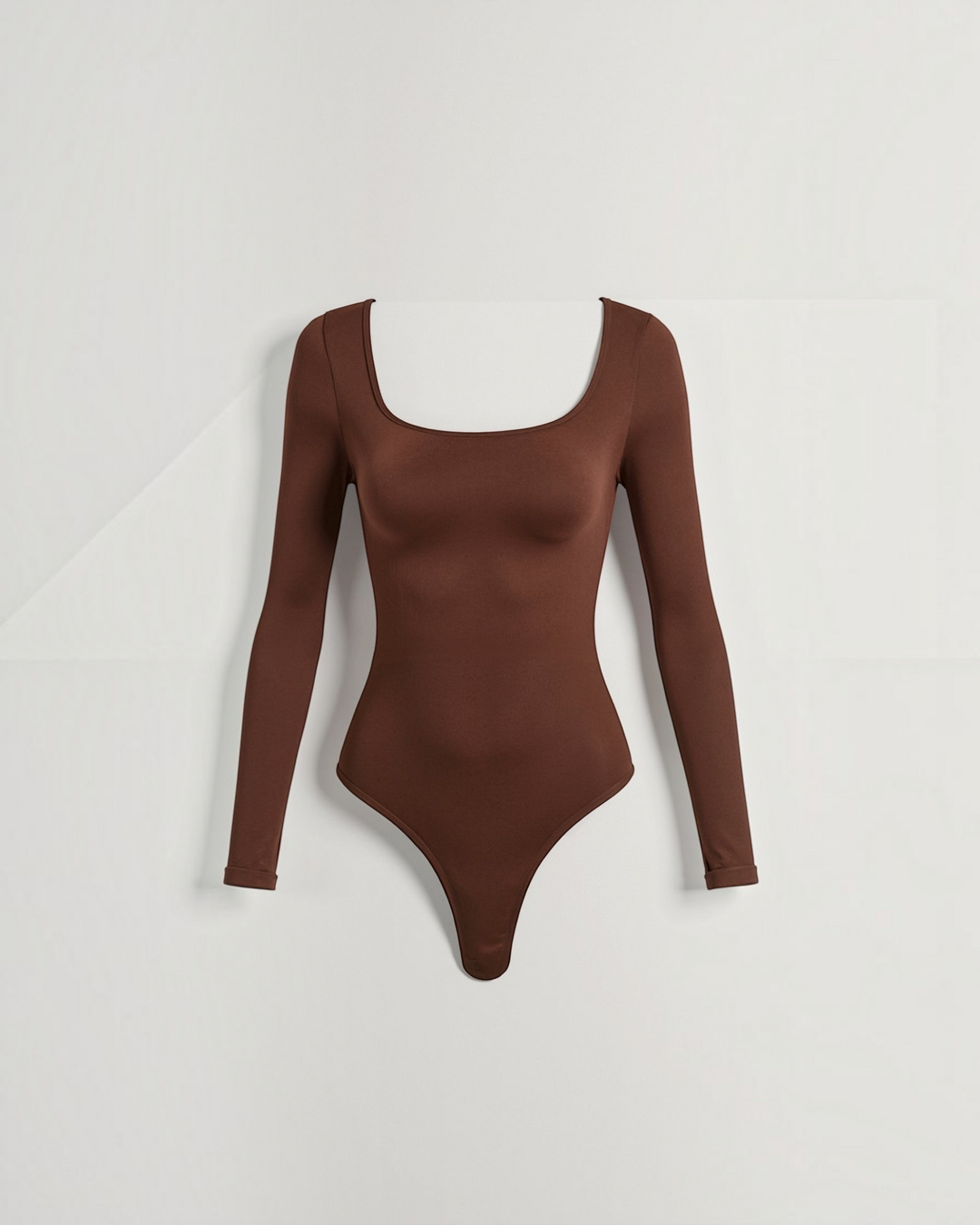 Luna Moda brown long-sleeve thong bodysuit with a square neckline in ultra-soft seamless stretch fabric.