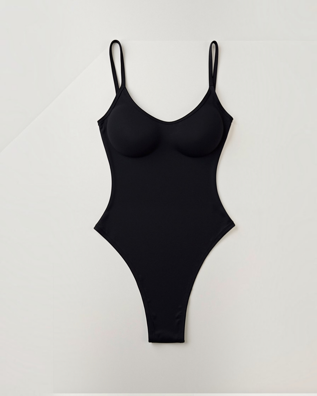 Luna Moda chocolate brown thong bodysuit with push-up cups, adjustable straps, and a sculpting fit.