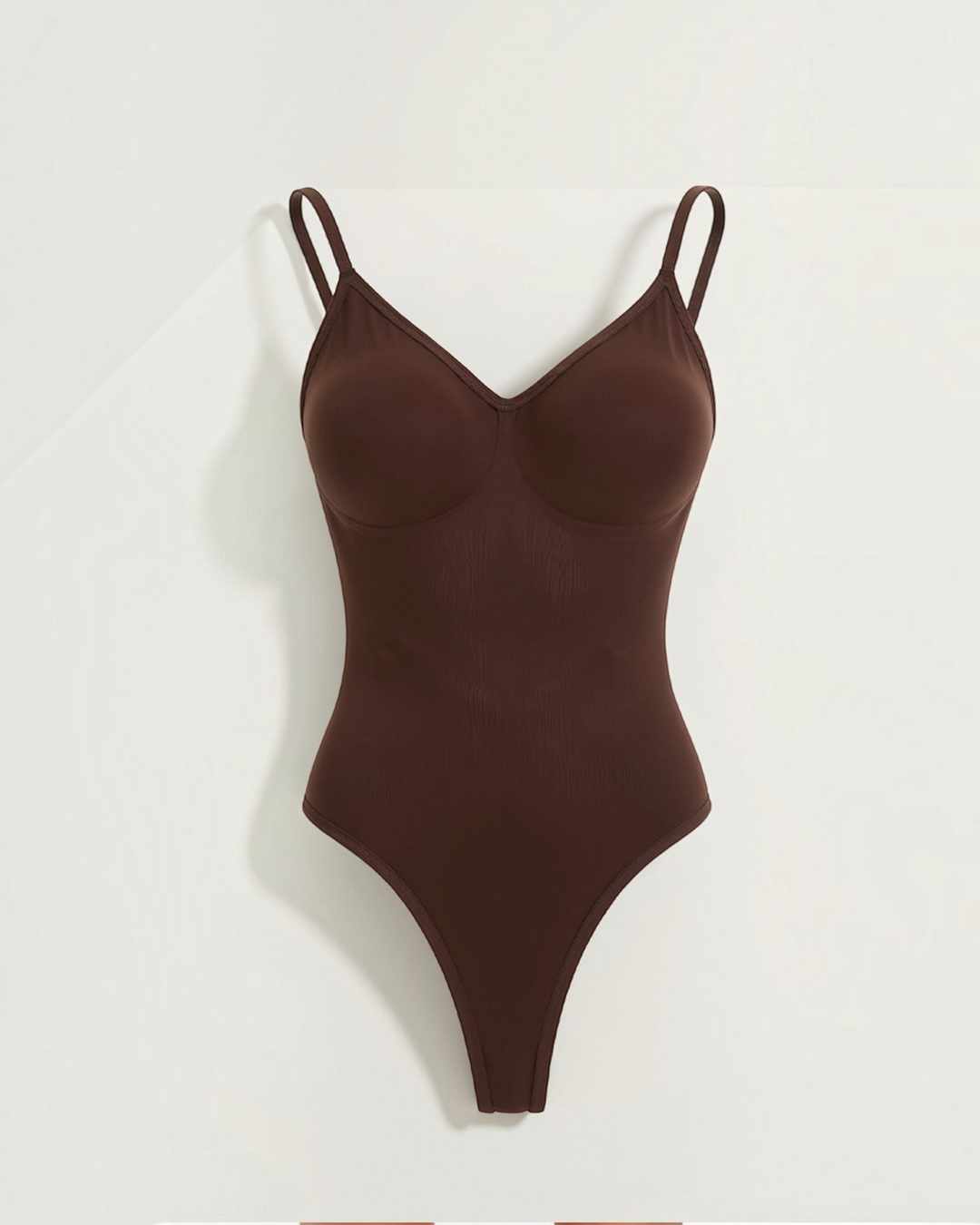 Luna Moda chocolate brown push-up thong bodysuit with adjustable straps and sculpting fabric for a smooth silhouette.