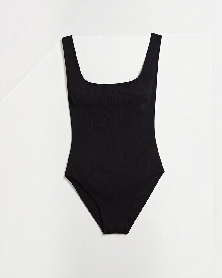 Luna Moda black ribbed bodysuit with a square neckline and compression technology for a sculpted hourglass silhouette.