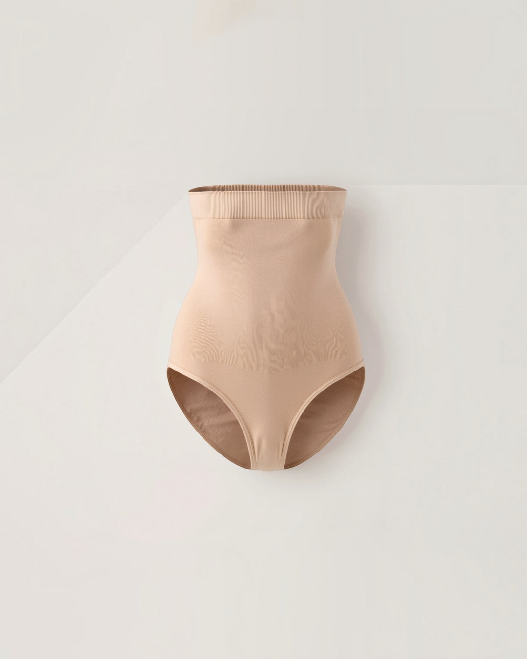 Luna Moda high-waisted beige shaping briefs with seamless bonded edges for a smooth silhouette under clothing.