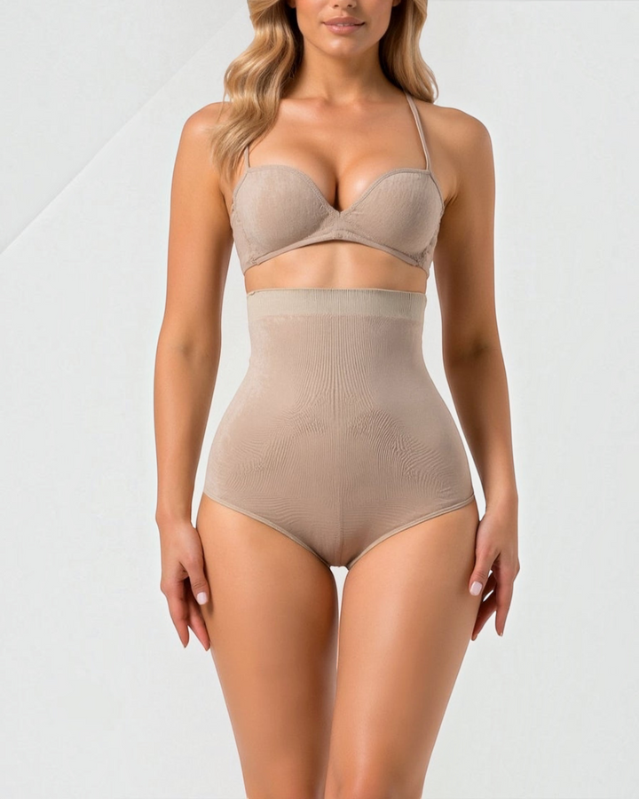 Luna Moda high-waisted beige shaping briefs with seamless edges for a smooth silhouette under clothing.