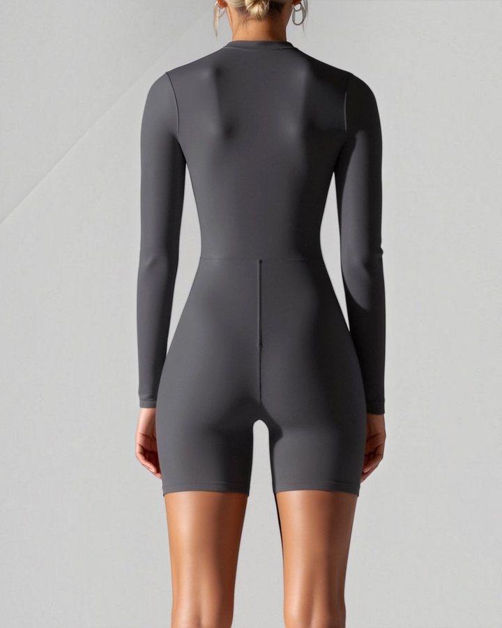 Luna Moda graphite seamless long-sleeve compression bodysuit with a high neck, back view on a model.