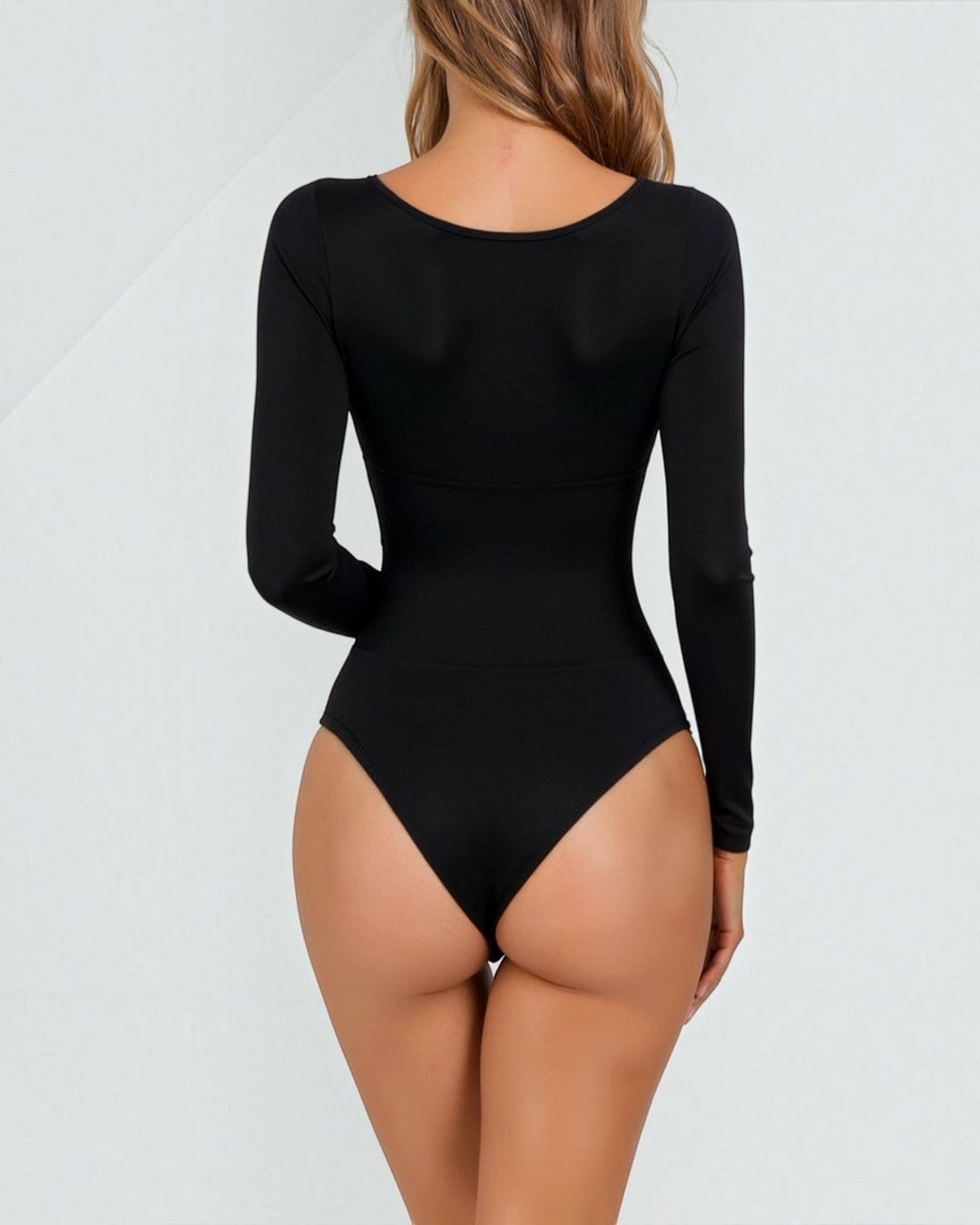 Luna Moda black long-sleeve thong bodysuit with seamless second-skin fit and back view on a model.