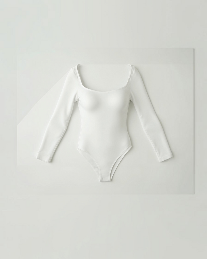 Luna Moda white long-sleeve seamless thong bodysuit with a scoop neck and ultra-thin compressive second-skin fabric.