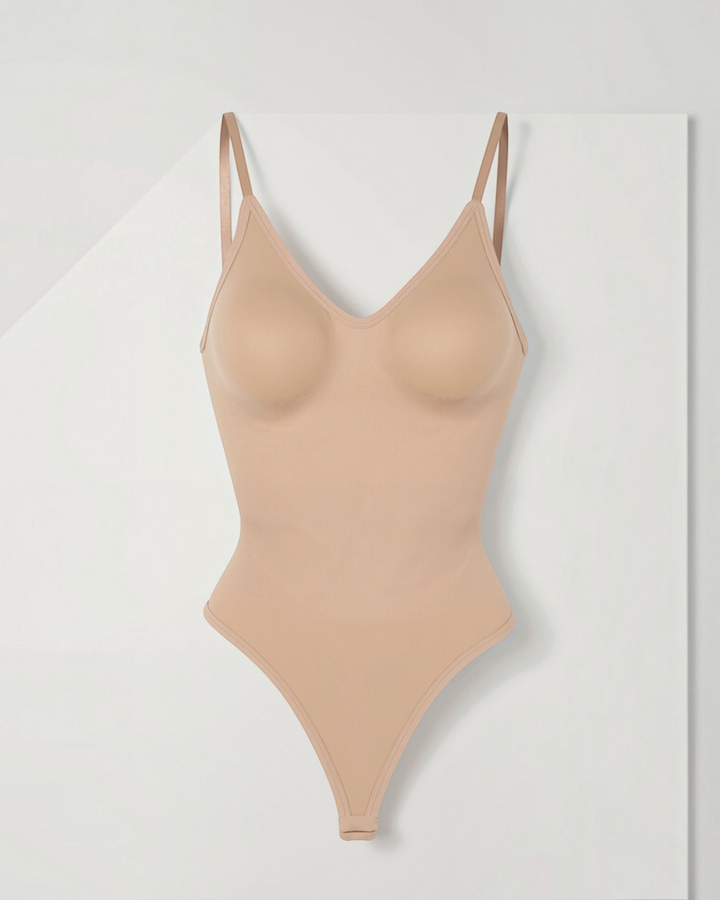 Luna Moda seamless beige shaping bodysuit with V-neck, thin straps, and low back design for a smooth silhouette.