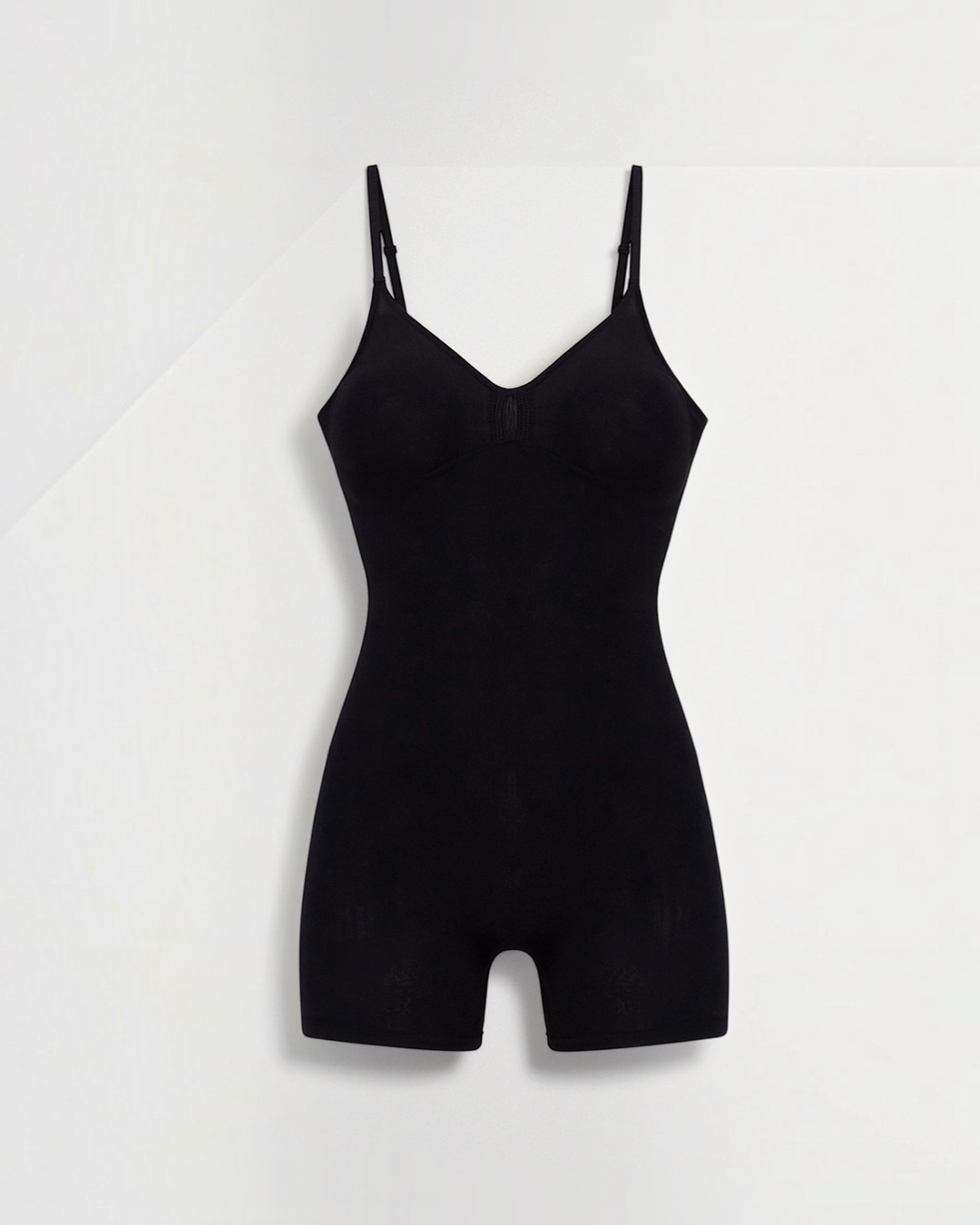Luna Moda black seamless mid-thigh shaping bodysuit with supportive straps and gentle bust ruching
