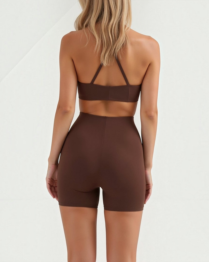 Luna Moda high-waisted seamless brown shaping shorts worn by a woman, back view showing smooth compression fit.