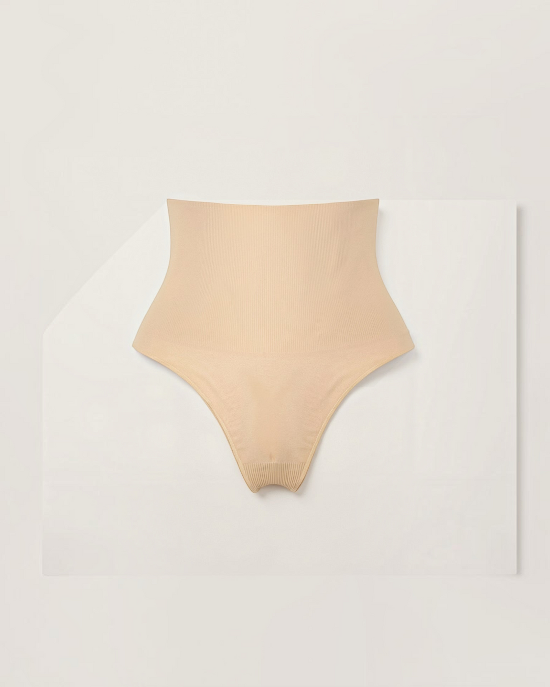 Luna Moda beige mid-rise seamless shaping thong in ultra-thin smoothing fabric for an invisible fit.