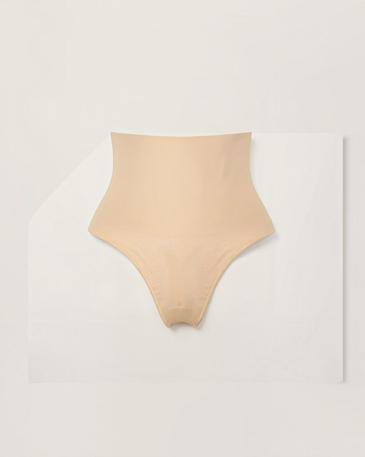 Luna Moda beige mid-rise seamless shaping thong in ultra-thin smoothing fabric for an invisible fit.