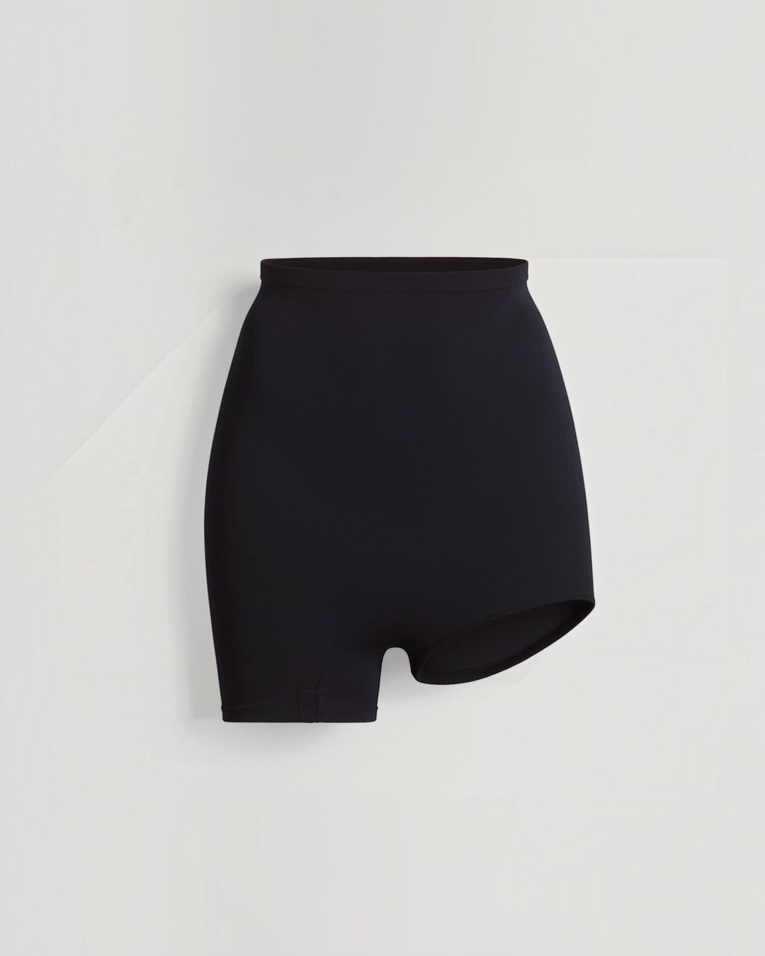 Luna Moda high-waisted seamless black shaping shorts with an asymmetrical left leg cut for side-slit dresses.