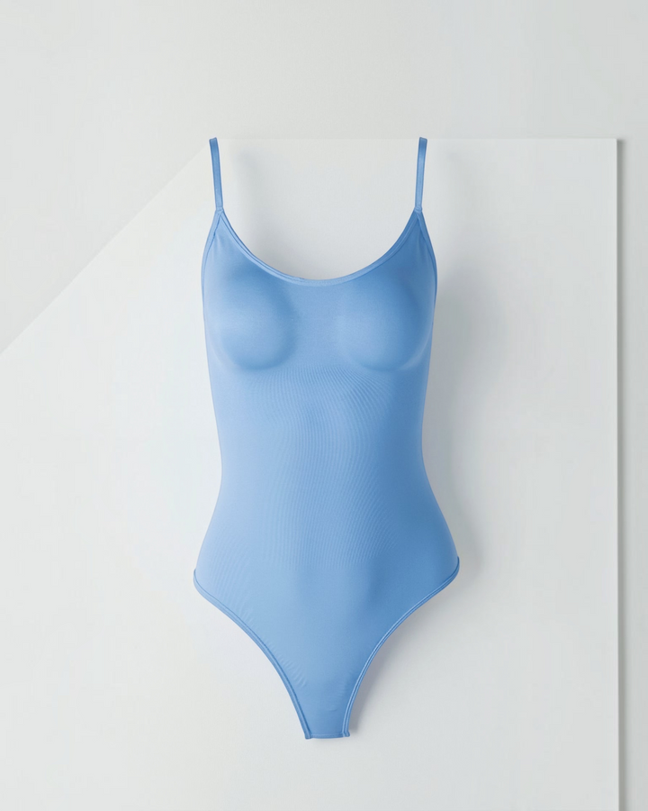 Luna Moda Snatched light blue thong bodysuit with a boat neckline, adjustable straps, and smoothing compression fabric.