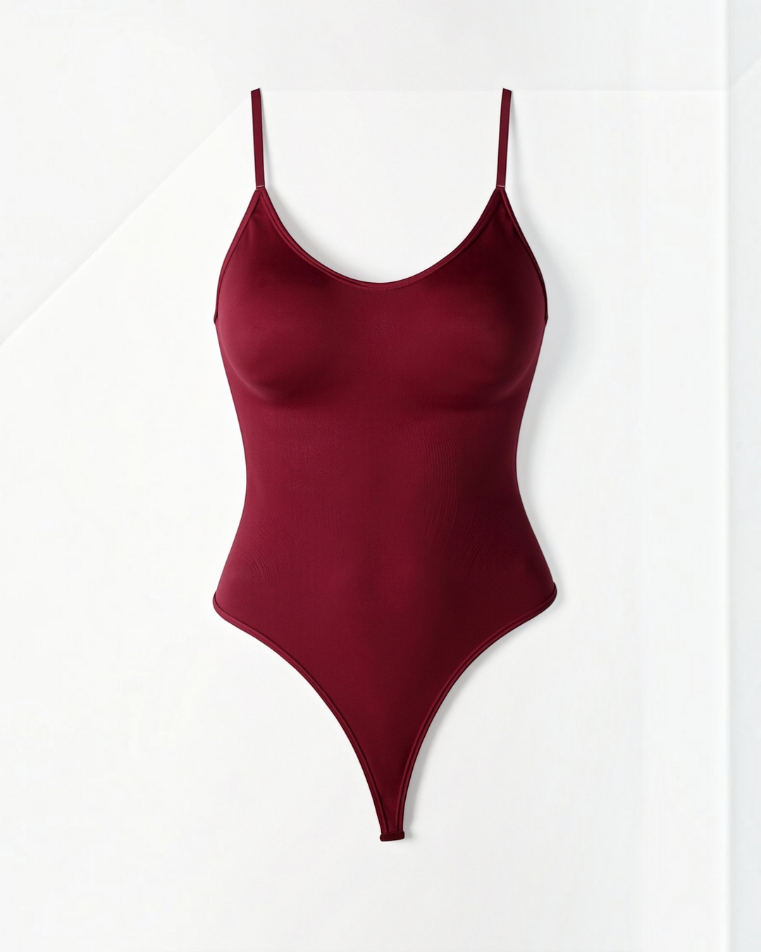 Luna Moda Snatched thong bodysuit in deep burgundy with a boat neckline and adjustable straps for a smooth fit.