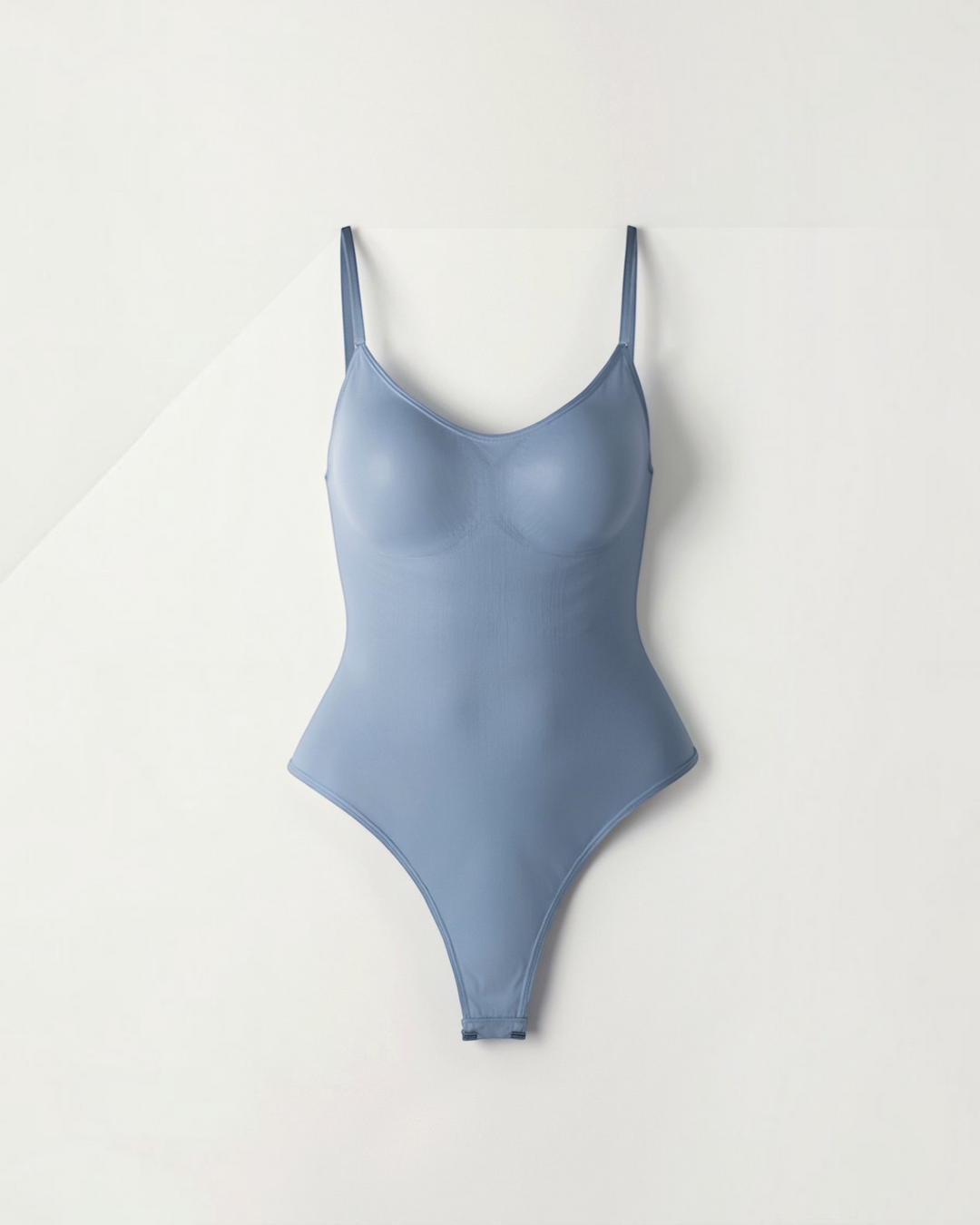 Luna Moda Snatched blue thong bodysuit with a boat neckline, adjustable straps, and seamless compression fabric.