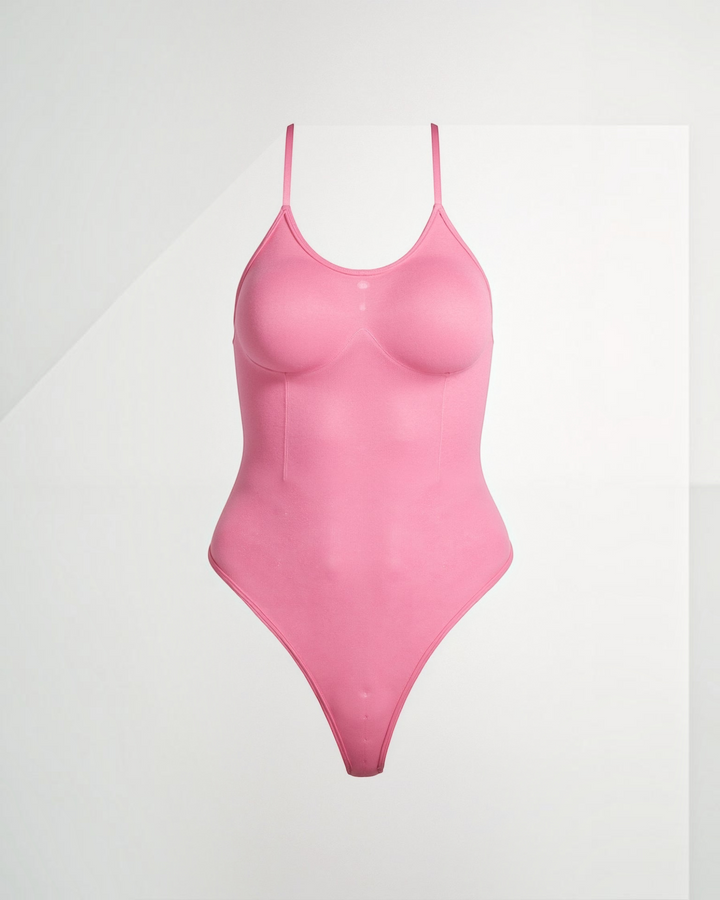Luna Moda pink snatched thong bodysuit with boat neckline, adjustable straps, and smoothing compression fabric.
