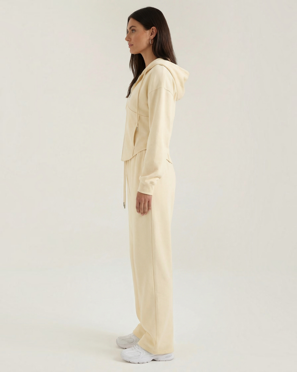Luna Moda Yolanda cream hooded sweatshirt and wide-leg lounge pants set worn by a model in profile view