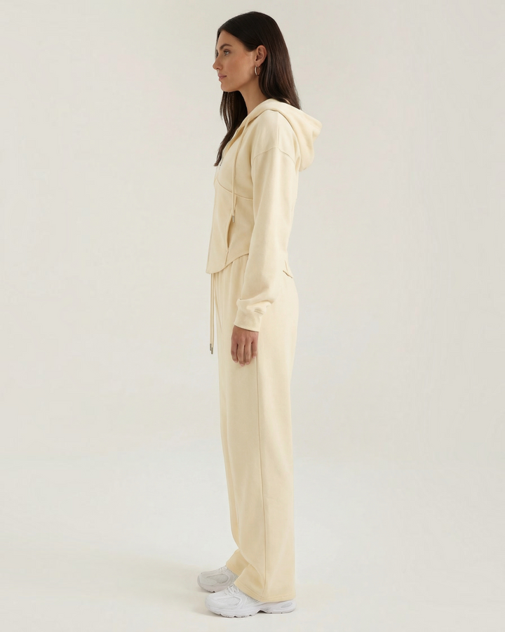 Luna Moda Yolanda cream hooded sweatshirt and wide-leg lounge pants set worn by a model in profile view