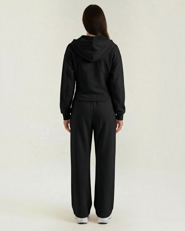 Luna Moda black two-piece set featuring a hooded sweatshirt and wide-leg trousers viewed from the back