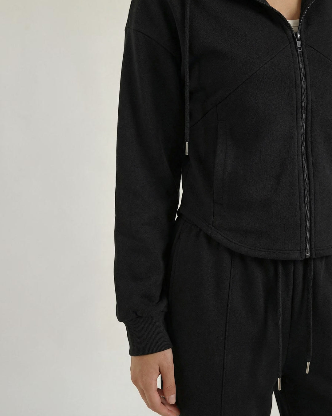 Luna Moda black two-piece set featuring a zip-up hoodie and wide-leg trousers in soft, comfortable fabric.