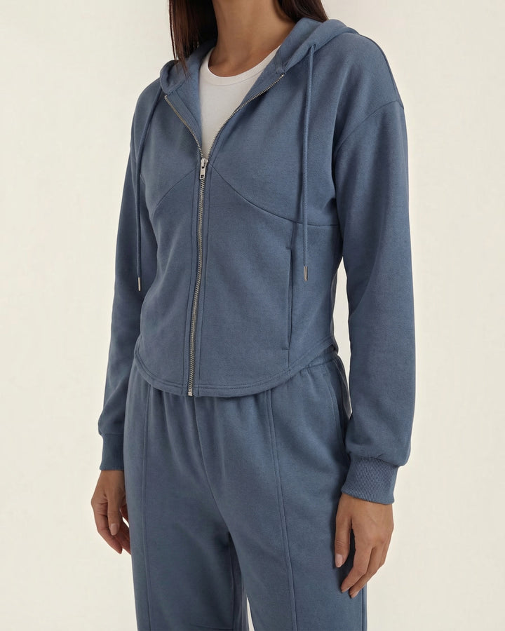 Luna Moda Yolanda blue two-piece set featuring a zip-up hooded sweatshirt and matching wide-leg trousers