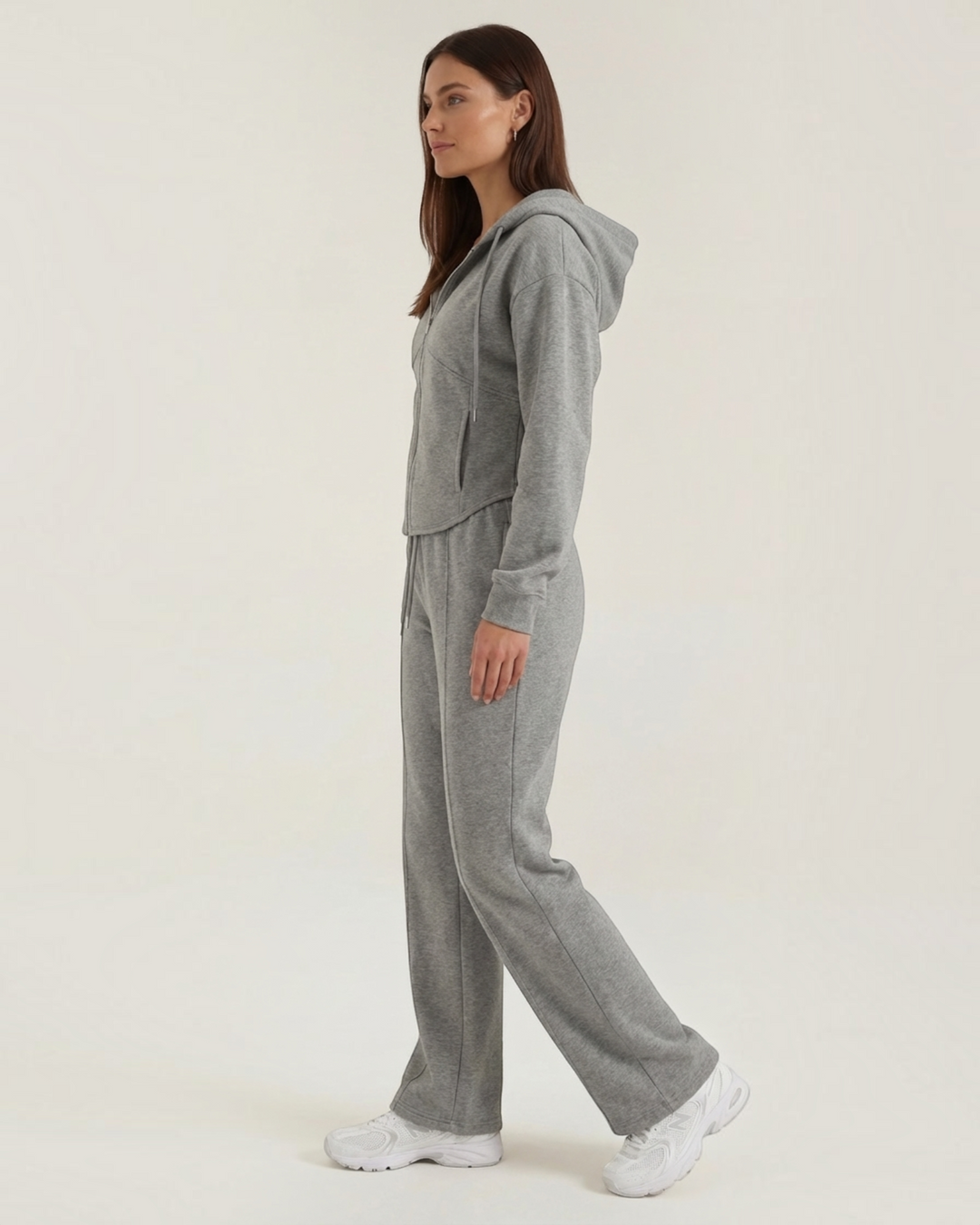 Luna Moda grey two-piece lounge set with a zip-up hoodie and wide-leg trousers worn by a model in profile view.