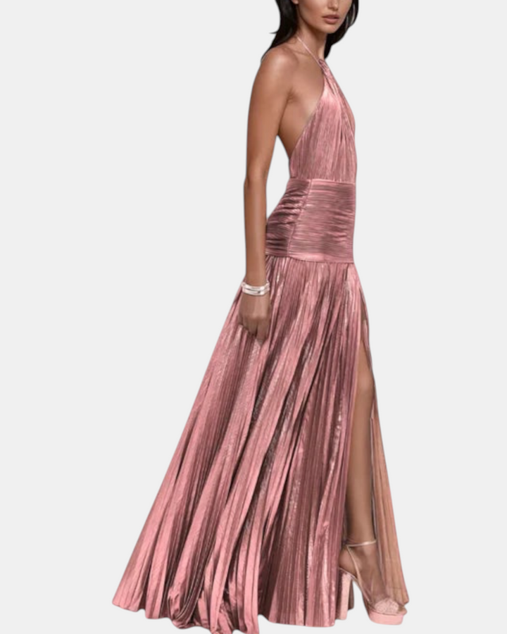 Luna Moda metallic peridot halter dress with open back and high leg slit worn by a model in a studio setting