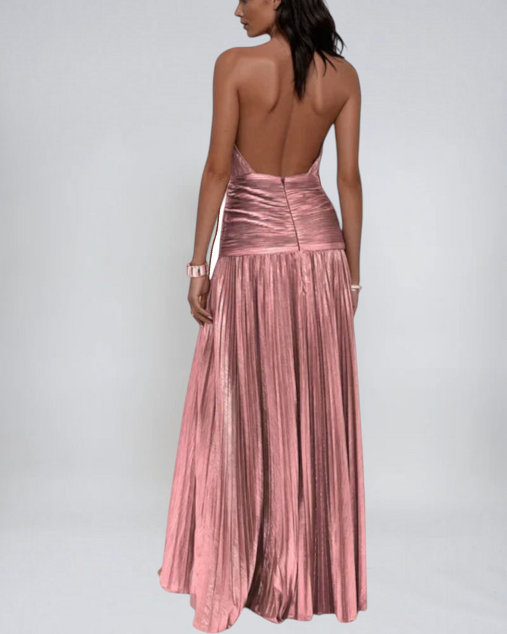 Luna Moda Emma metallic pink halter neck maxi dress with an open back and pleated skirt worn by a model