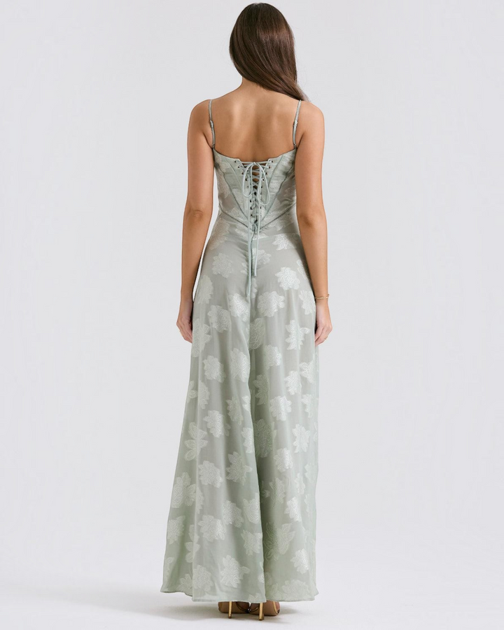 Luna Moda sage green floral maxi dress with a lace-up corset back and spaghetti straps, back view on a model.