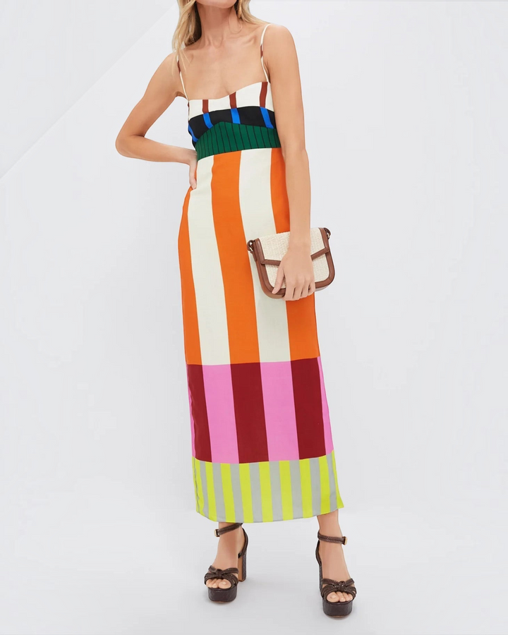 Luna Moda Paloma maxi dress with vibrant geometric stripes, thin straps, and a fitted bodice on a model.